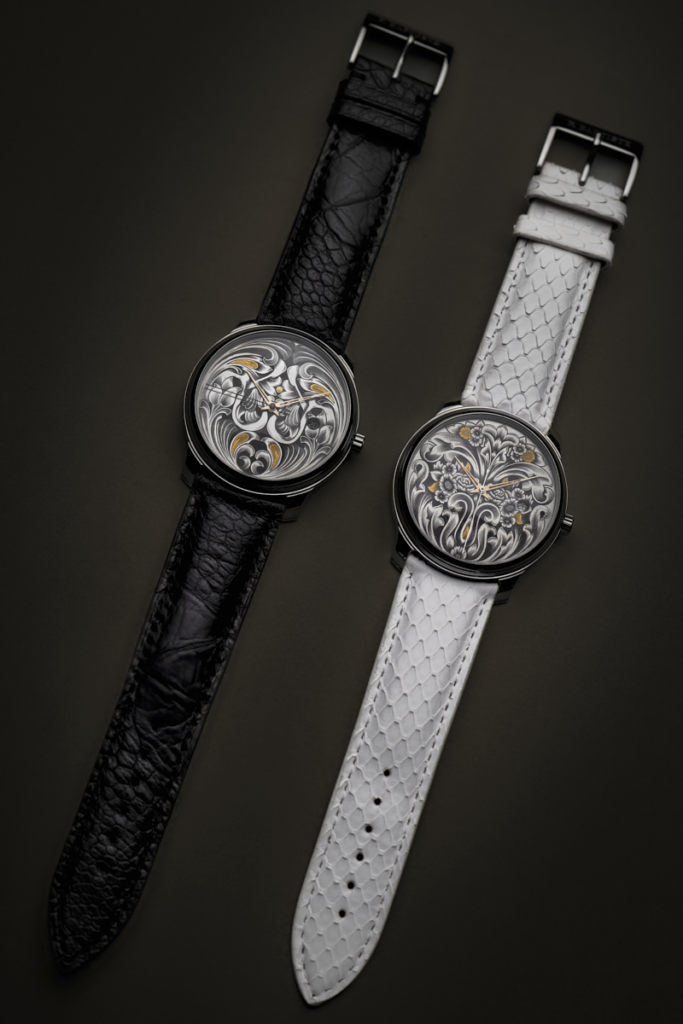 Deux montres d'art RBaptiste Voltaire présentées côte à côte sur des bracelets en cuir d'alligator noir et de galuchat blanc.